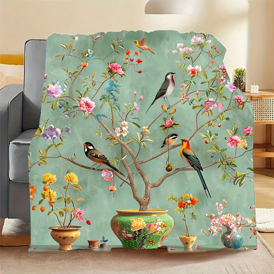 Soft, Portable Green Floral & Bird Print Fleece Blanket. This tear-resistant and stain-proof blanket is made from 100% polyester, offering all-season comfort. Perfect for home decor and travel, it is also machine washable for easy care.