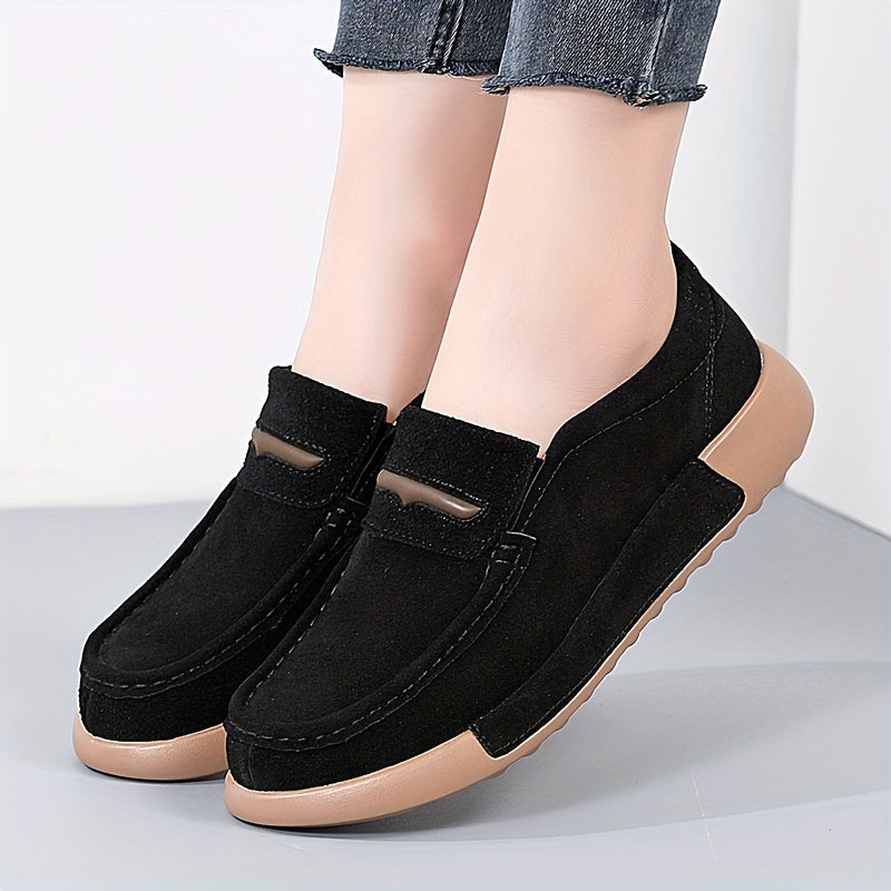 Women's slip-on loafers in solid color with round toe, casual low-top design.