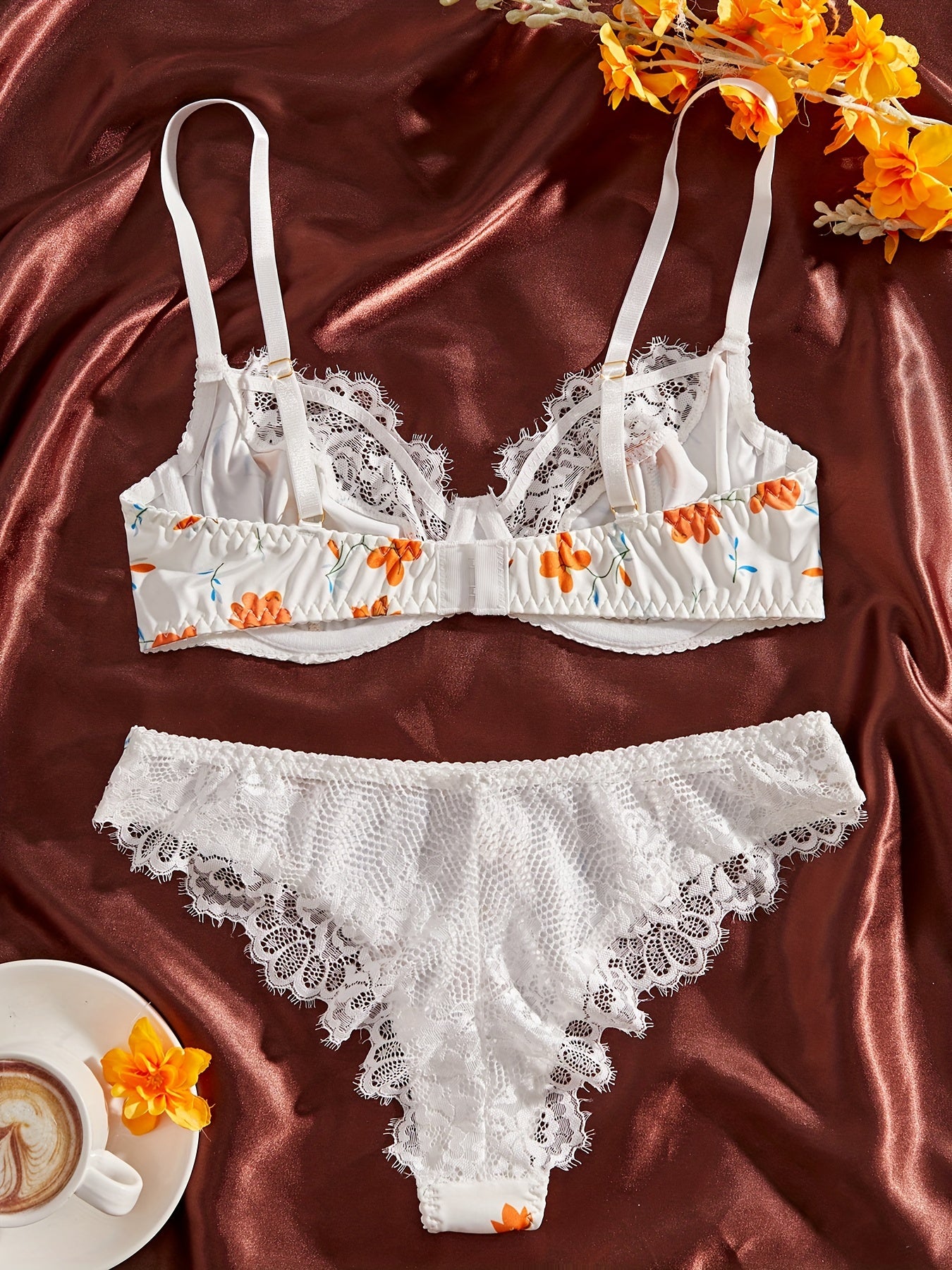 Stylish lace-trimmed floral print bra and panty set for women. Comfortable polyester blend, machine washable.