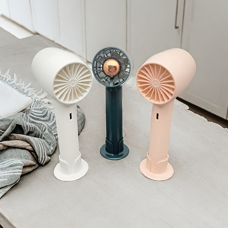 Cangling Green Handheld Small Fan is the perfect mini fan for on-the-go convenience. Easily foldable with a bracket for support, this USB fan is ideal for desktop use, hanging around your neck, or keeping in your dorm room or office. With 3-speed