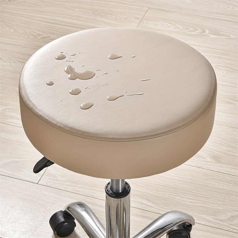 Waterproof faux leather stool cover in black, red, and brown. Elastic fit for various settings. Machine washable.