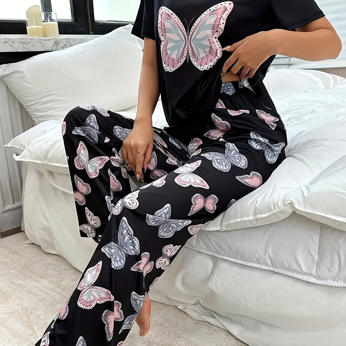 Butterfly print pajama set for women with round neck and short sleeve top, elastic pants.