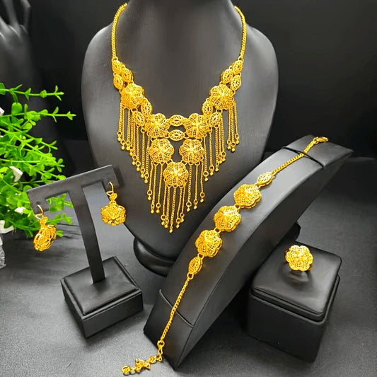 This beautiful 24k gold-plated tassel  flower jewelry set includes a necklace, a pair of earrings, a bracelet, and a ring. Perfect for any fashionable lady, this four-piece set is inspired by designs from Saudi Arabia, Africa, Europe, and America.