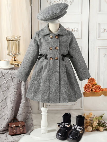 Youthful girls can look stylish in this casual polyester trench coat with lapel collar, double-breasted design, and matching bow detail and hat.