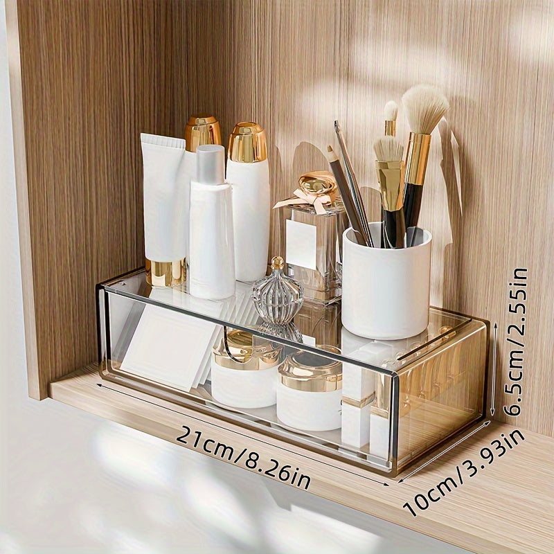 Cosmetics storage box with drawers, stackable design for bathroom and bedroom organization.