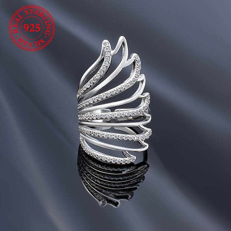 This elegant ring for women exudes a touch of luxury, featuring intricate angel wings with sparkling synthetic zirconia. Made of lightweight silver weighing 6 grams, this open ring is perfect for daily wear, special occasions, and weddings.