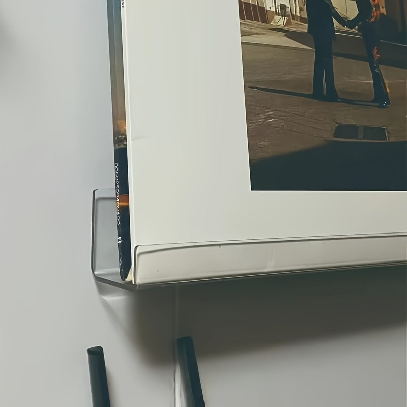 One piece of a 12-inch Acrylic Record Rack in black, used to display records and CDs on the wall.