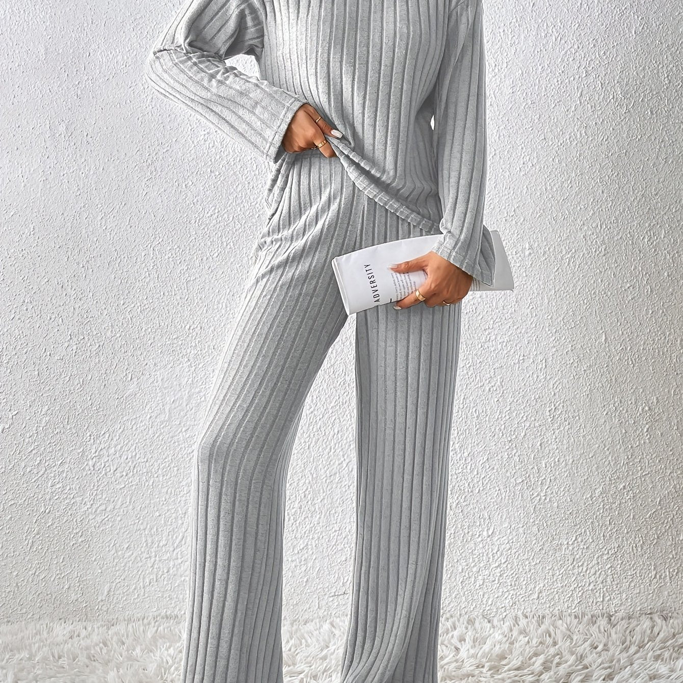 Fur-trimmed casual suit with high collar, solid long sleeve top, and loose trousers two-piece set for women.