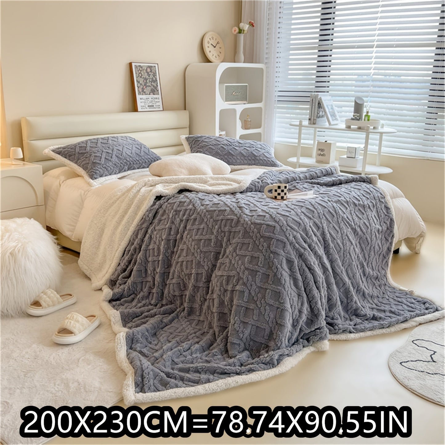 Soft cable-knit fleece blanket in blue, available in 150x200cm or 200x230cm sizes. Featuring a contemporary style, this blanket is machine washable and perfect for use in the bedroom, living room, office, or while camping during the winter. Made with a