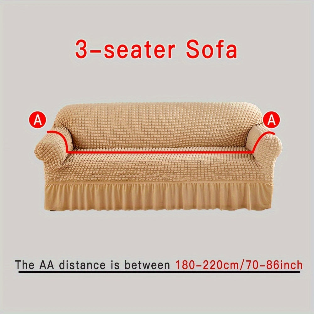 Stylish beige sofa cover with elastic skirt. Fits all sofa sizes and is machine washable. Perfect for any room decor. Great for living room sofas.