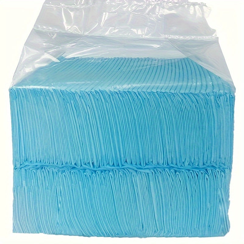 Leak-proof disposable dog training pads for pet hygiene. Absorbent non-woven fabric in light blue, secure fit for house training and incontinence.