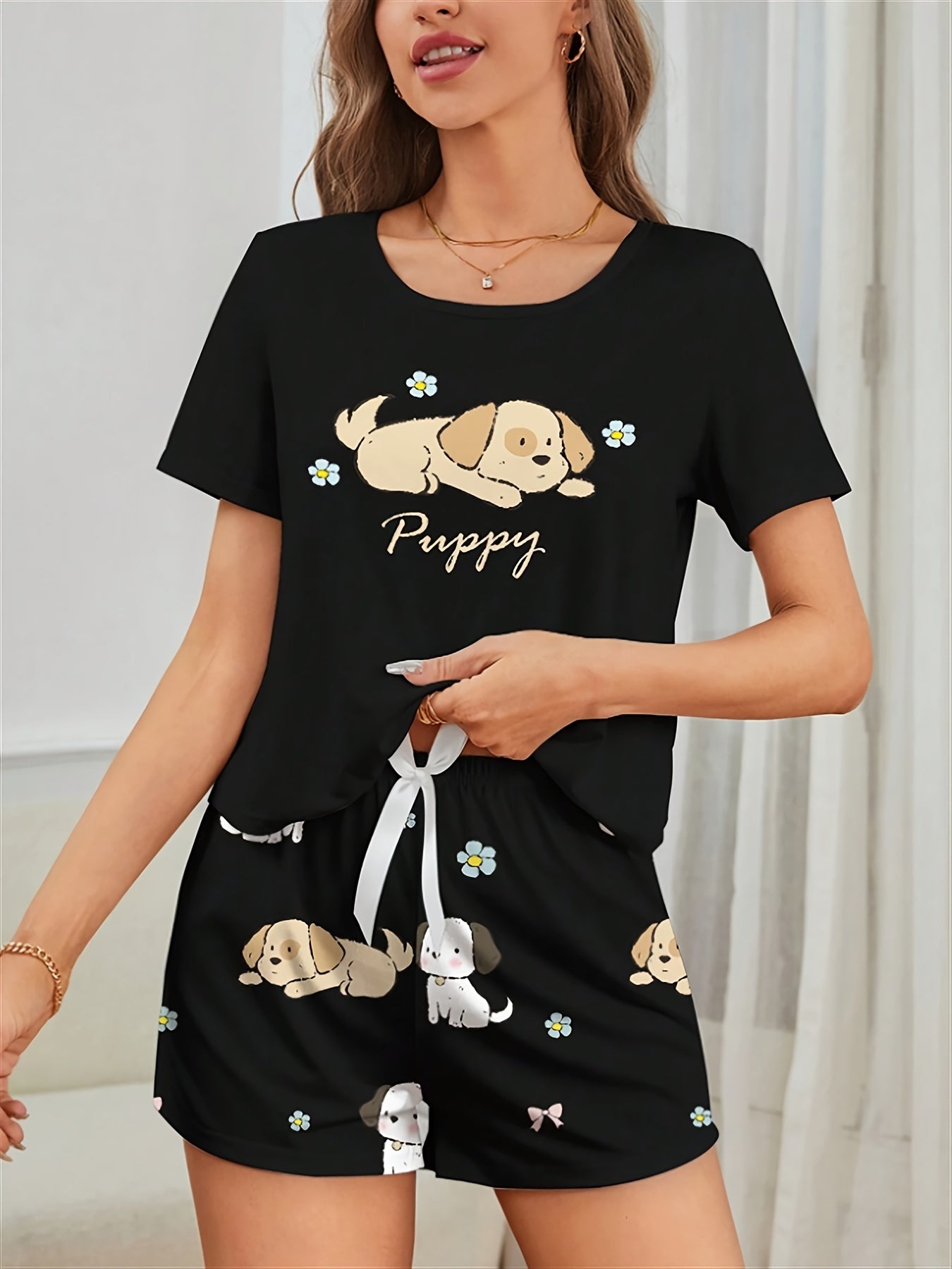 Women's Puppy Print Pajama Set. Cute cartoon design with short sleeve top and shorts for a comfortable fit.