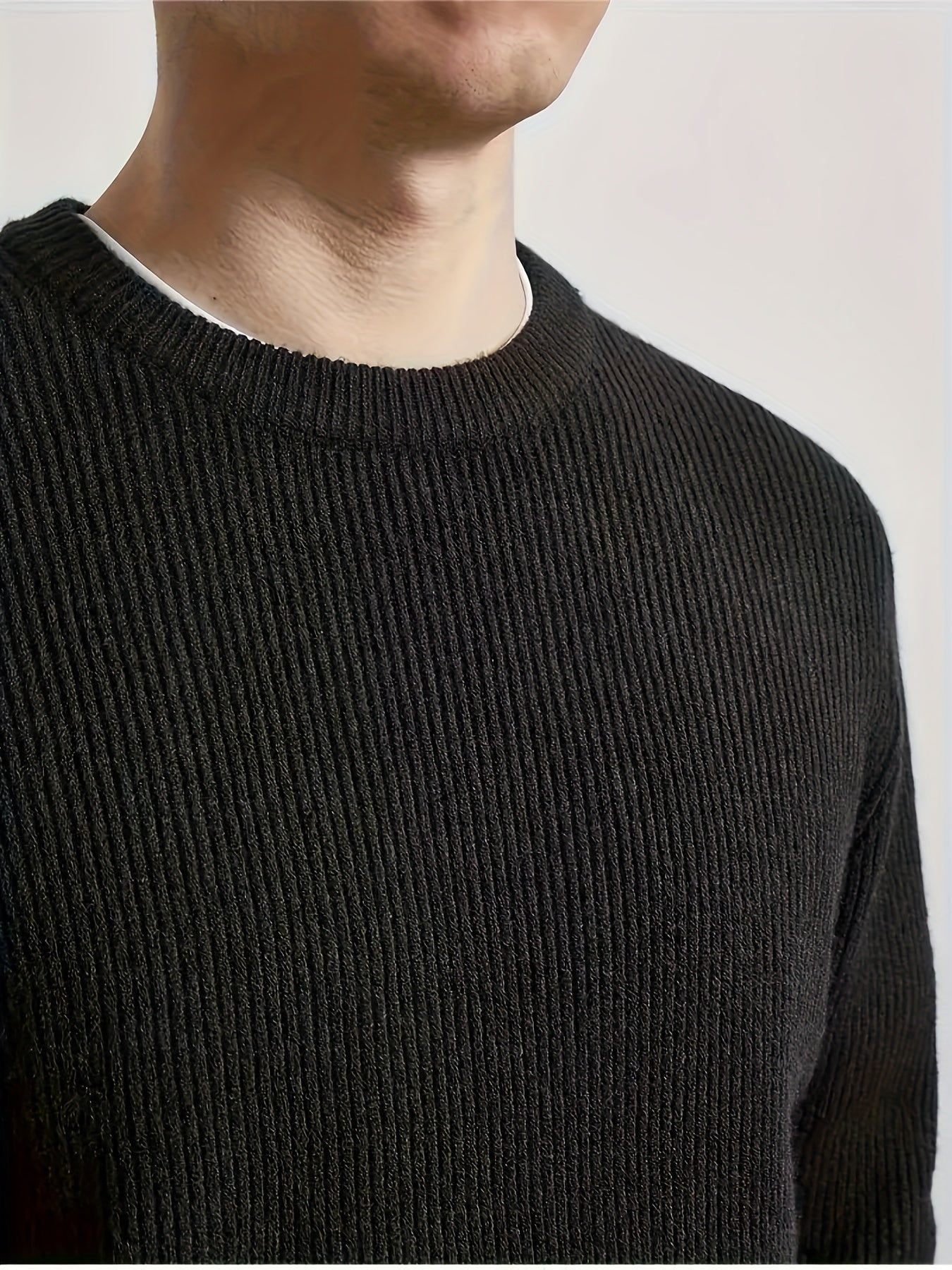 Men's black cotton-blend crew neck sweater with soft ribbed texture, perfect for fall/winter warmth in a casual attire.