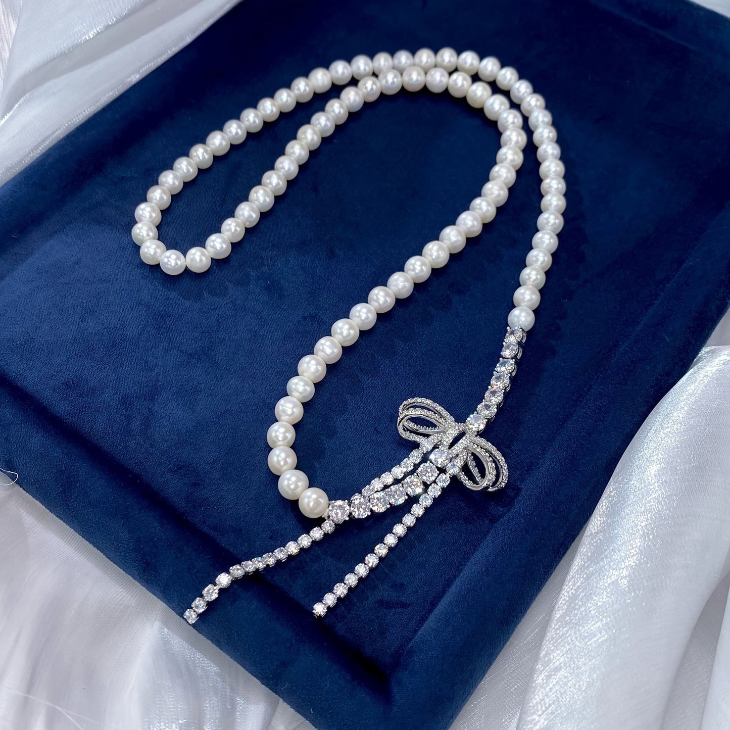 Chic Pearl Necklace adorned with Sparkling Cubic Zirconia Bow - Ideal for Weddings, Mother's Day, and Special Events