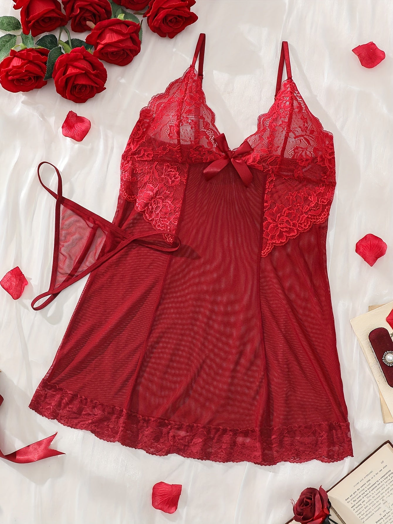 Women's sexy lingerie set features elegant sheer lace and mesh babydoll nightgown with floral detailing, V-neck, ruffled slip dress. Made of a polyester blend with lace accents.