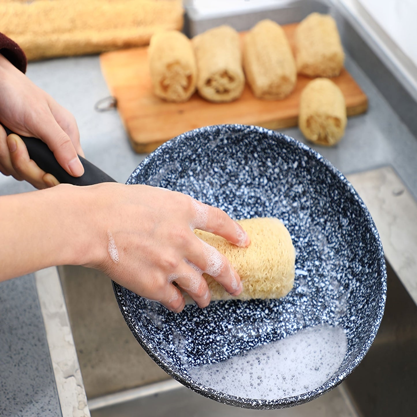 A set of four natural loofah sponges made from wood pulp fiber. These rectangular sponges are lightweight and made from non-woven fabric, making them reusable for various purposes such as bathing, spa treatments, skincare, kitchen cleaning, dishwashing