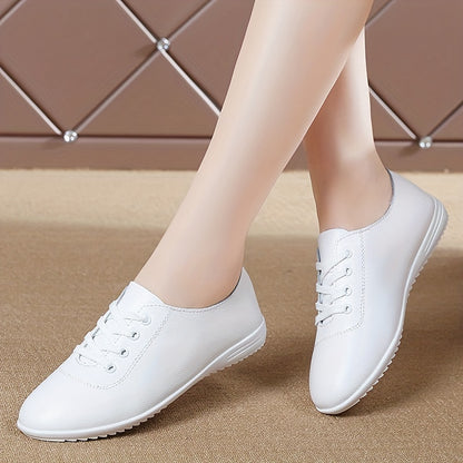 Women's lightweight solid color lace-up flat shoes for casual walking.