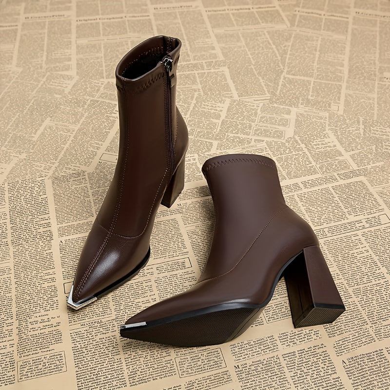 Stylish ankle boots with pointed toe, chunky heel, faux cover, and side zipper closure for all seasons.