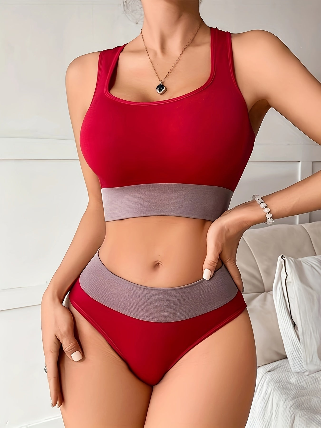 Colorblock seamless sports bra and panty set for women made of high support nylon-elastane blend that is non-see-through.