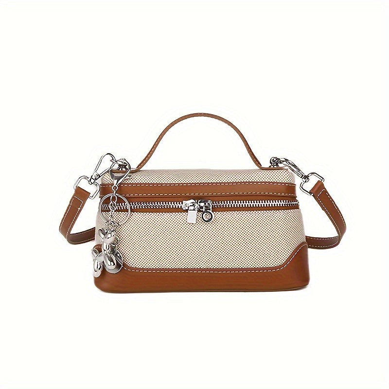 Retro-inspired mini crossbody bag for women in colorblock design, with adjustable strap and zip closure in black/blue/dark red/light brown/orange.