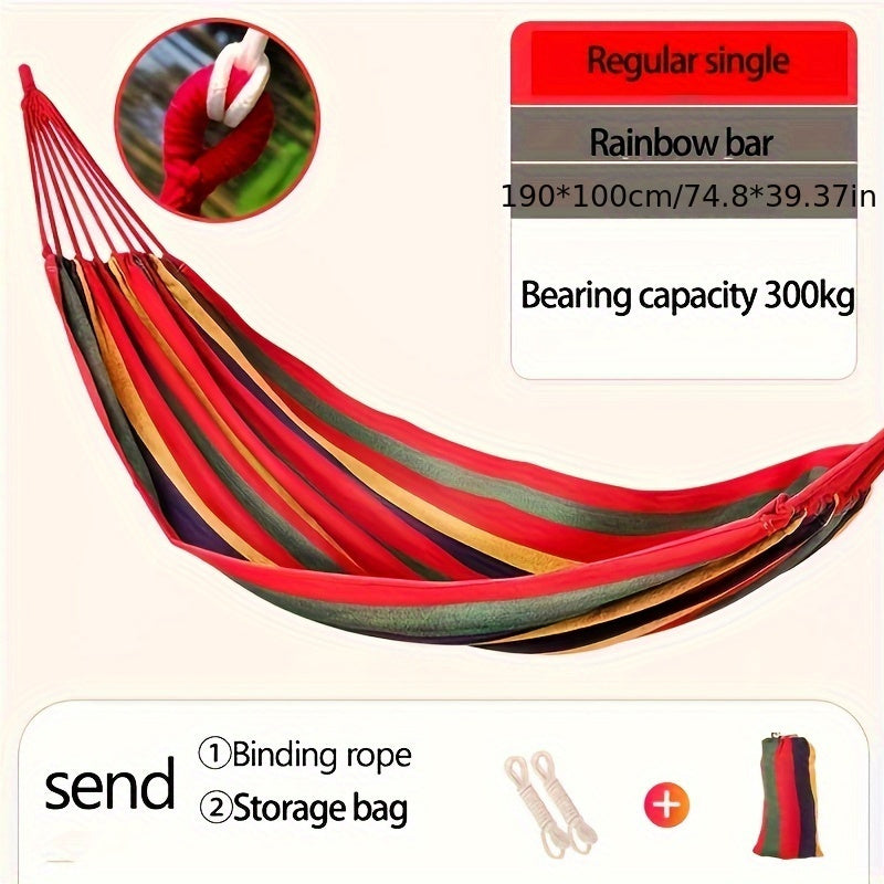 Heavy-duty rainbow canvas hammock for single or double with curved wooden sticks and a weight capacity of 226.8 KG. Includes tree straps for camping, backyard, or patio. High-strength