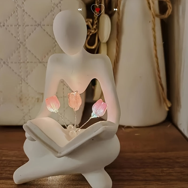 Modern abstract human figure & tulips LED night lamp with adjustable brightness. Ideal bedroom desk decor and birthday gift. Battery-powered with push button control.