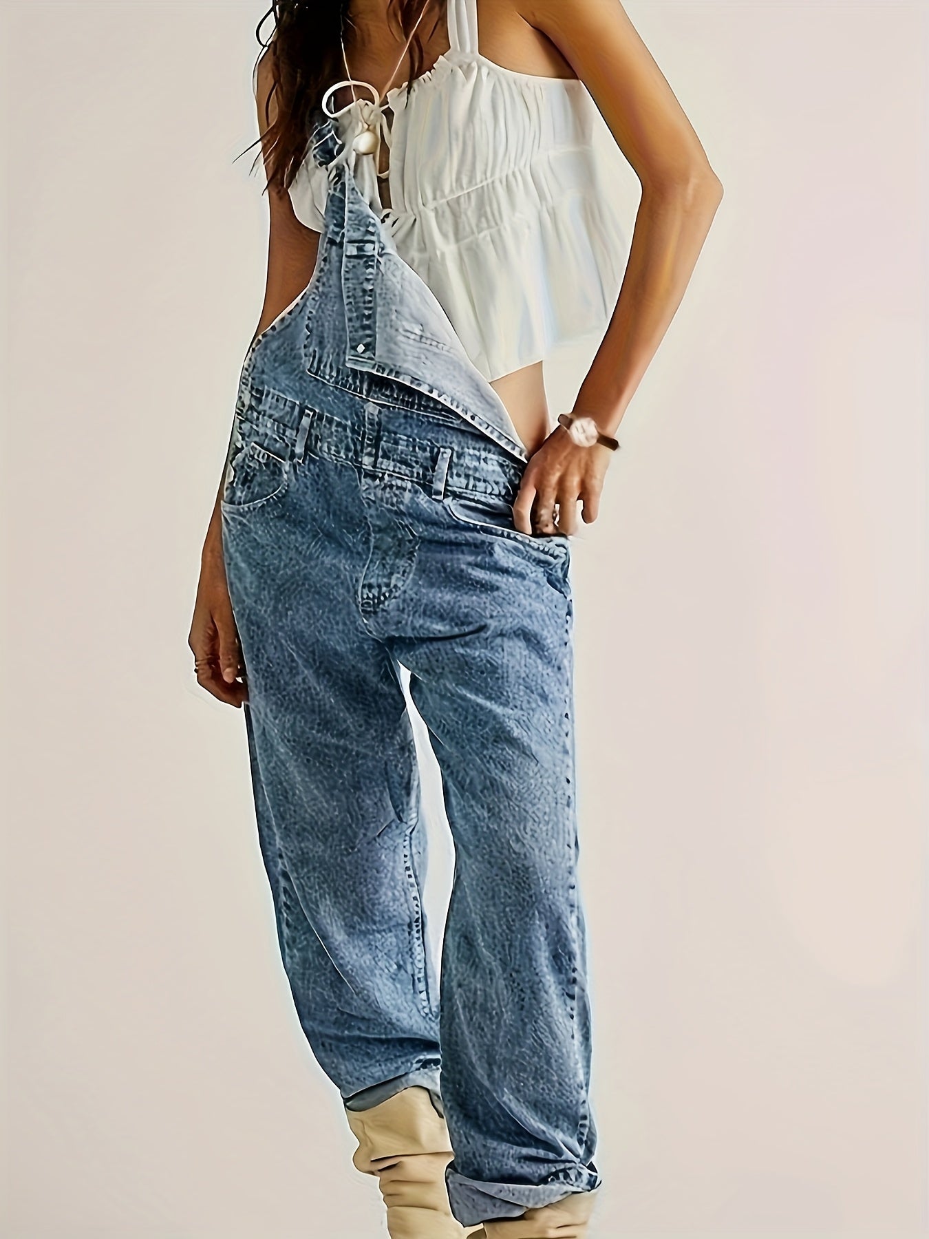 Casual solid color denim overalls for women, made of viscose and polyester blend fabric, strappy back design, no belt included, regular fit.