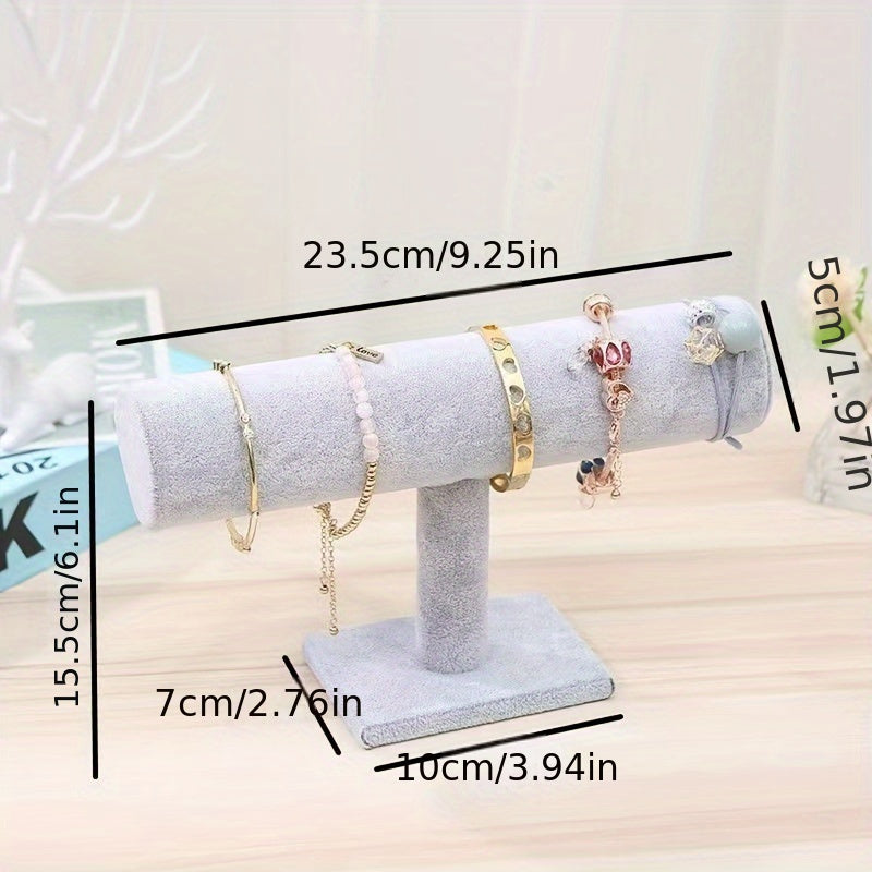 Elegant 3-tier velvet jewelry display stand with wooden base, white marble and black rollers. Multi-level organizer for bracelets, watches, and home decor. Perfect for showcasing in stores or at home. Features elegant design with marble texture.