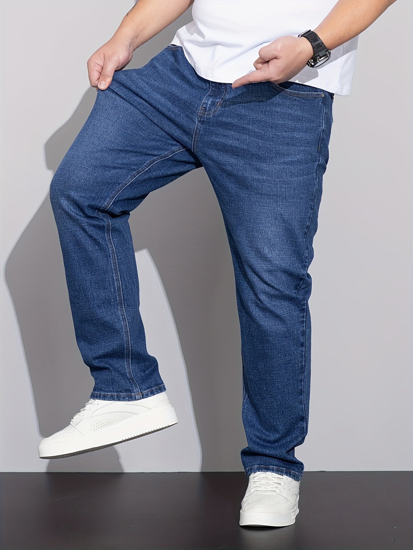 Men's plus size denim jeans with comfort flex, straight leg, washed detail, solid color, cotton blend with stretch.