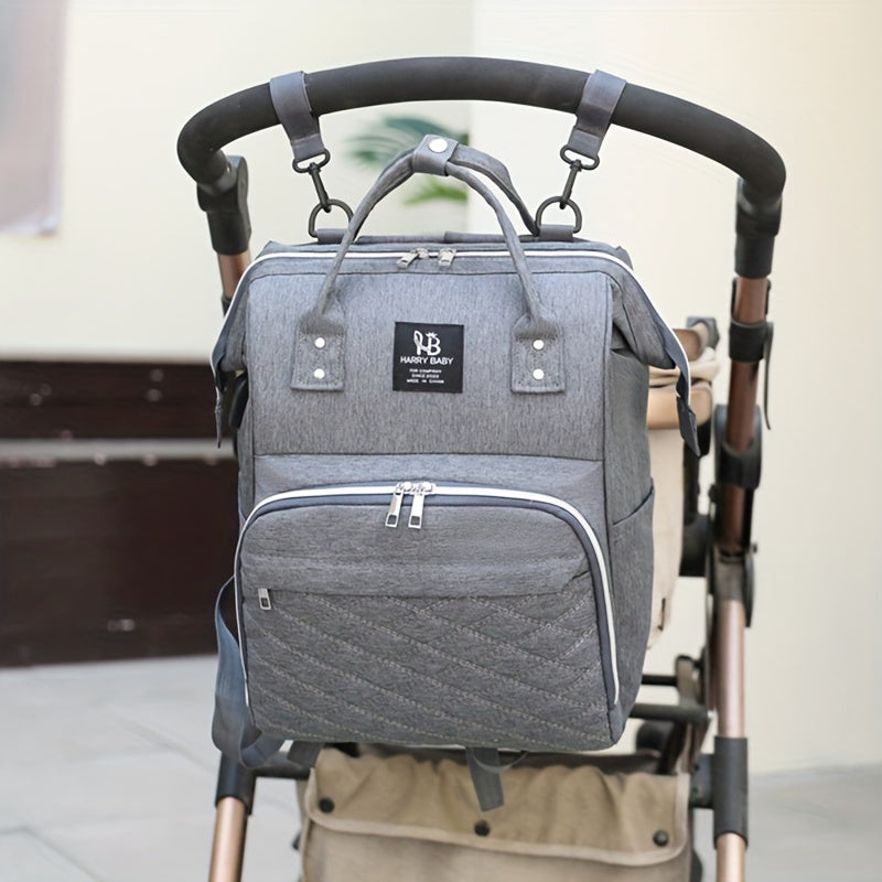 Large waterproof grey mommy backpack with bottle warmer, utility pockets, and soft shell for casual use.