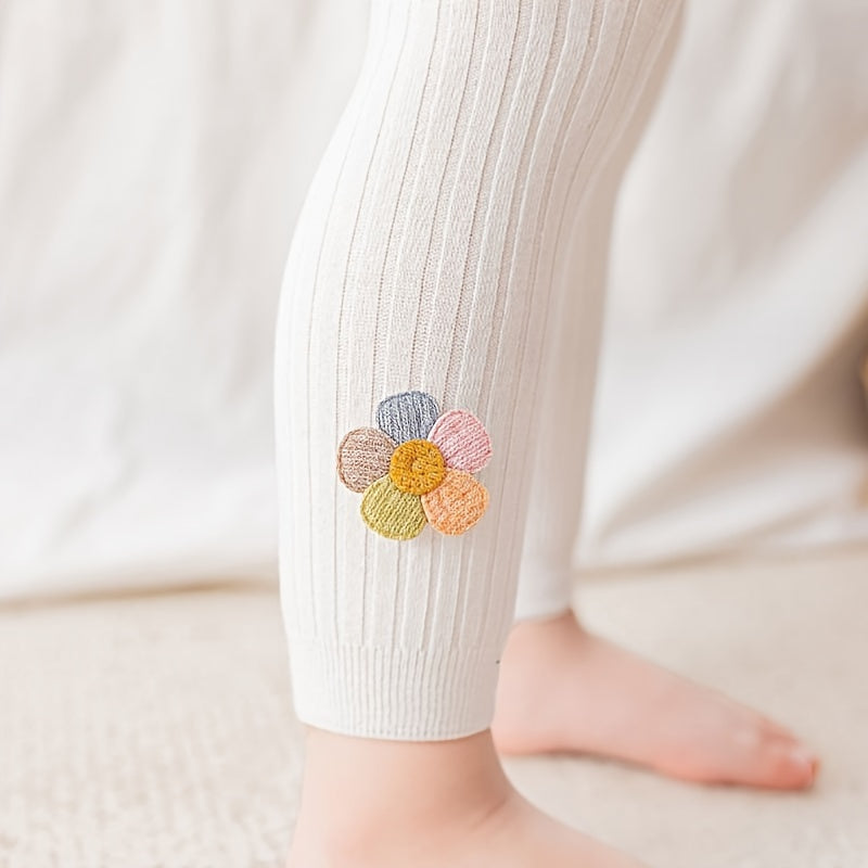 Girls slim legging pants with rib knit flower doll design, made of cotton blend stretch fabric for a tight fit.