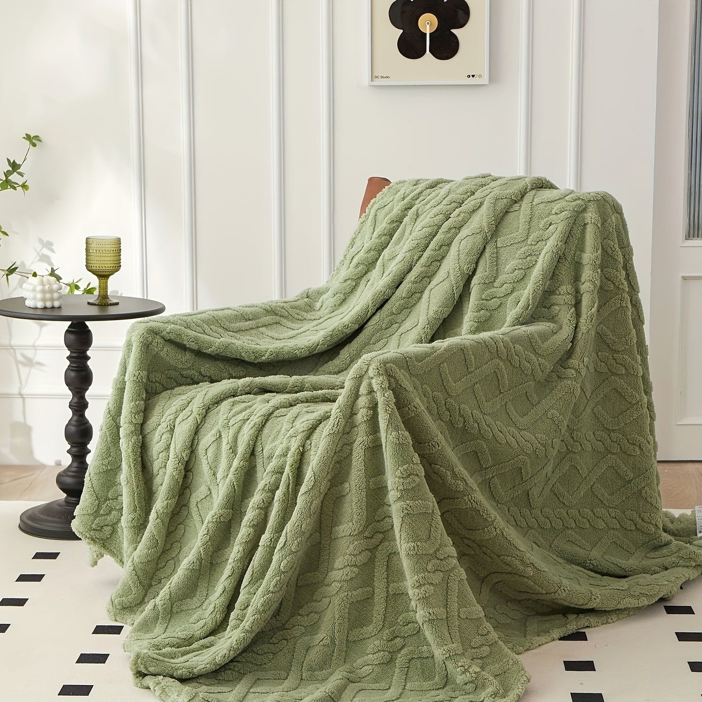 Stay cozy all year round with the July Casa Ultra-Soft Jacquard Velvet Blanket. This thick, reversible throw is perfect for any season and is machine washable for easy cleaning. Available in a beautiful green color.