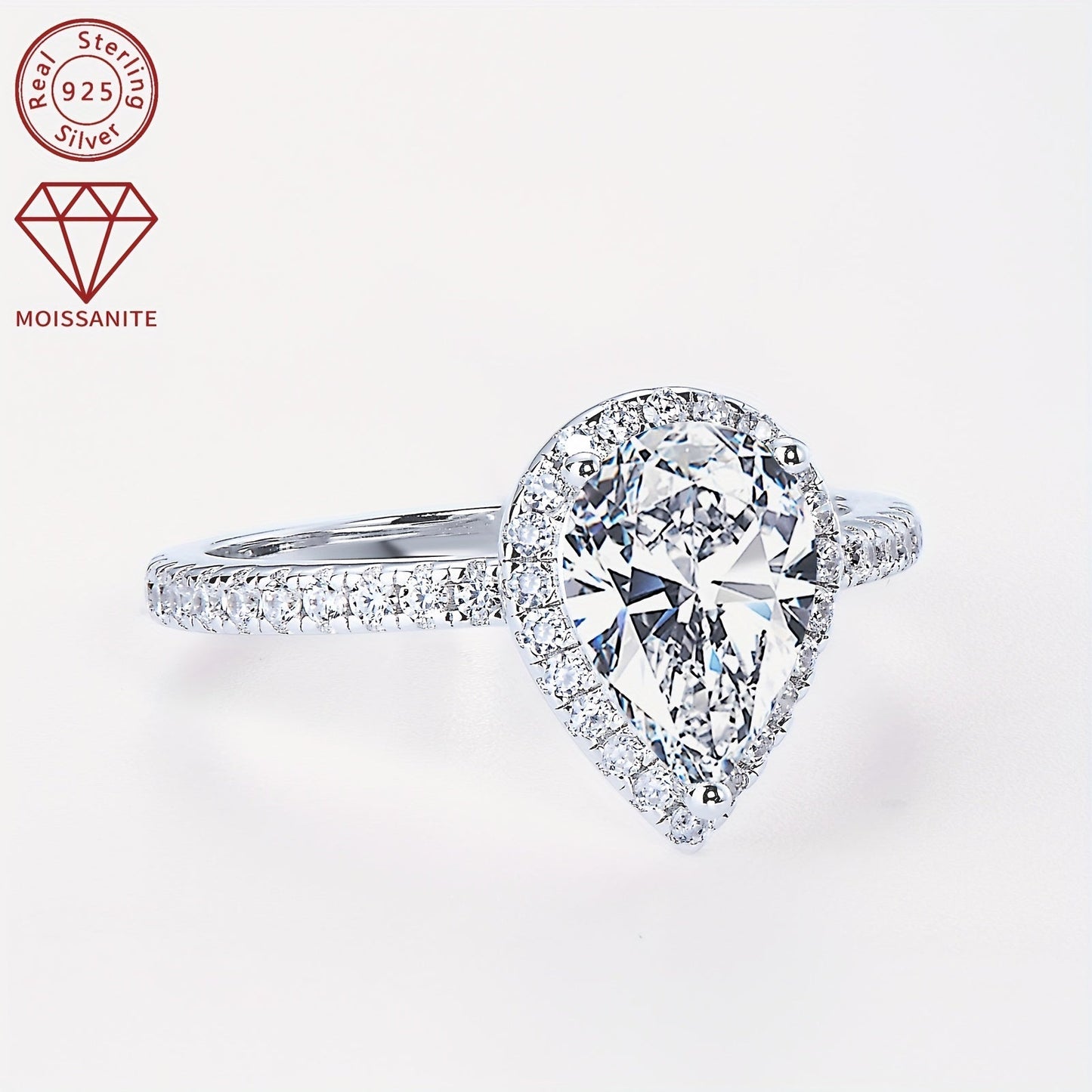 925 Sterling Silver Women's Engagement Ring featuring a center Moissanite pear-shaped stone measuring 7x10mm and weighing 2 carats. Surrounding the center stone are additional Moissanite stones, creating a stunning teardrop shape. This ring is perfect