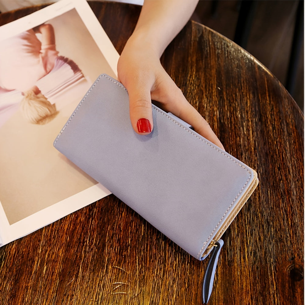 Black synthetic leather women's wallet with golden leaf design, featuring card holders, coin pouch, and snap closure.