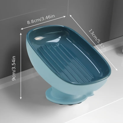 Suction cup soap dish with drainage for bathroom and kitchen sink storage.