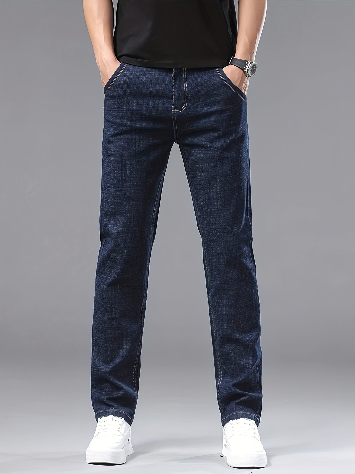 Men's slim-fit jeans made of 61.6% cotton, 36.9% polyester, and 1.5% spandex with all-season stretch denim. Raw wash in a solid color, regular fit for casual weekends. 200gsm woven fabric.