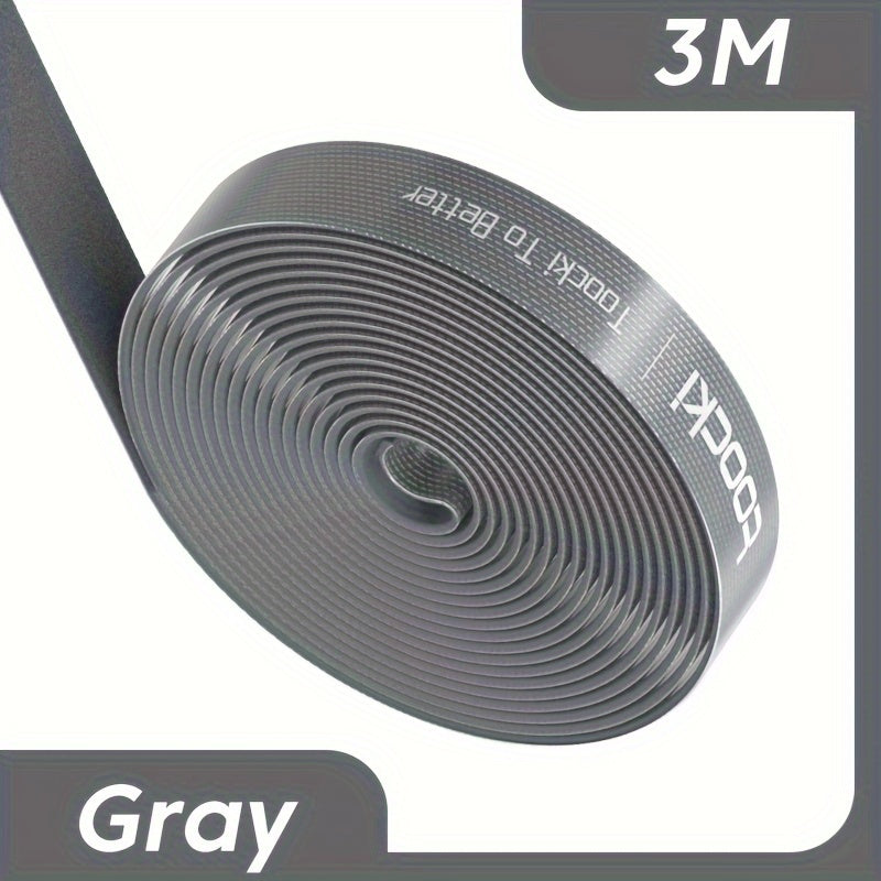 Black and gray nylon cable winder tape for iPhone, Xiaomi, and Poco for desk organization and management. Durable and adhesive under desk organizer.