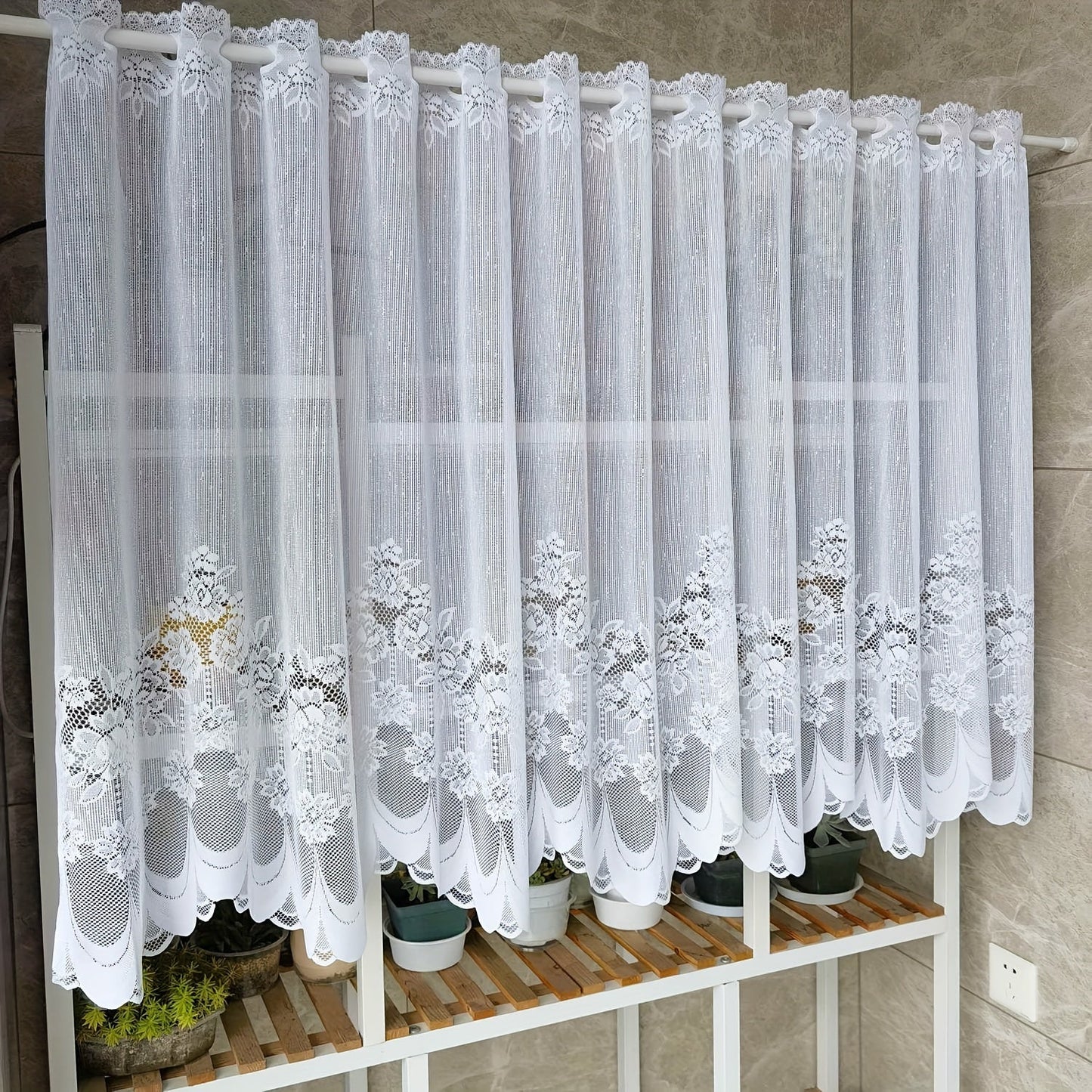 Bring elegance to your windows with our 1-piece White Lace Sheer Curtain featuring delicate floral patterns. This curtain has a rod pocket, scalloped bottom, and is made of lightweight polyester voile, perfect for dining rooms and kitchens. It is