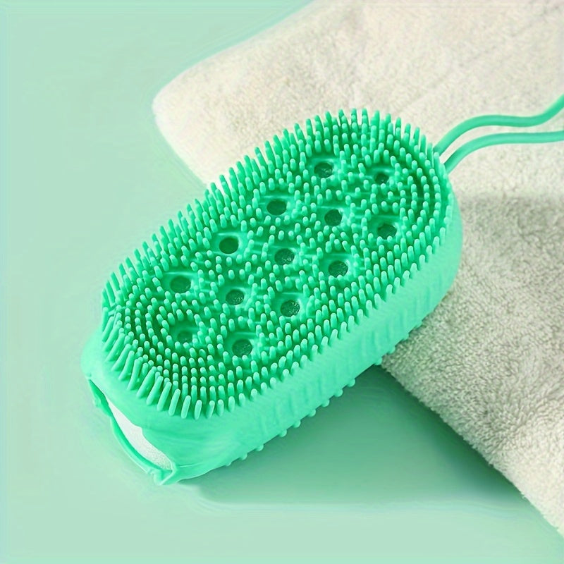 Silicone body scrubber for exfoliating and cleaning in the shower.