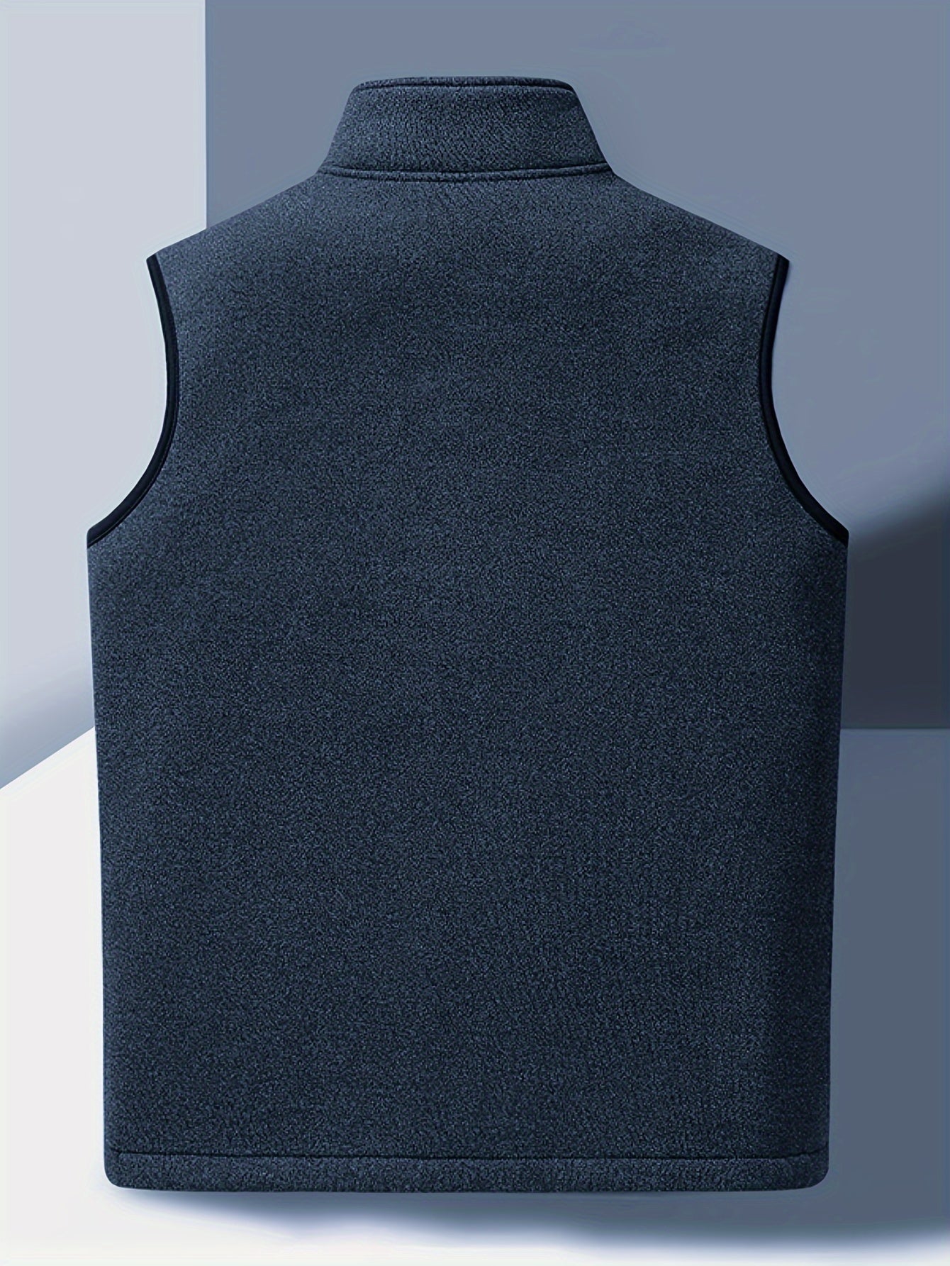 Men's cozy fleece-lined vest with stand collar, zipper pockets, and button closure for fall/winter warmth.