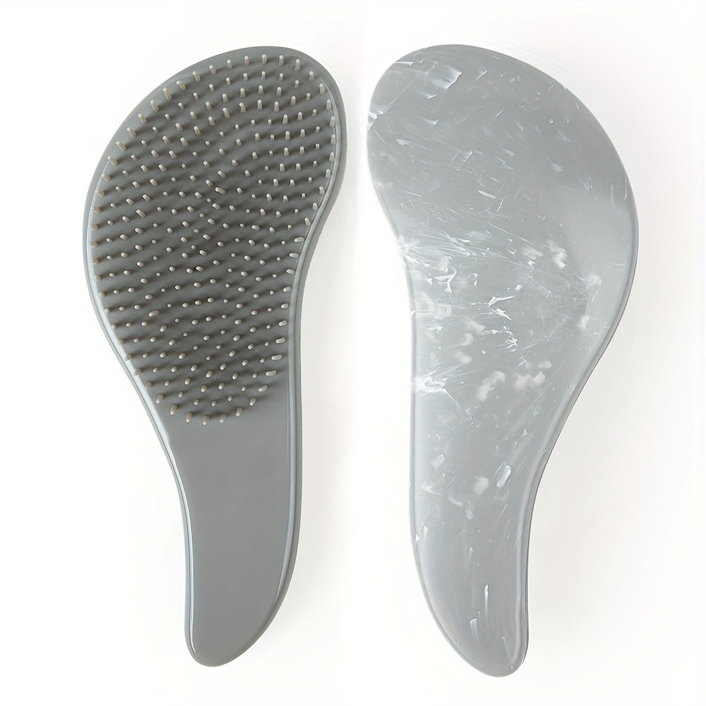 Portable, tiny massage comb for detangling hair with a starry sky design.