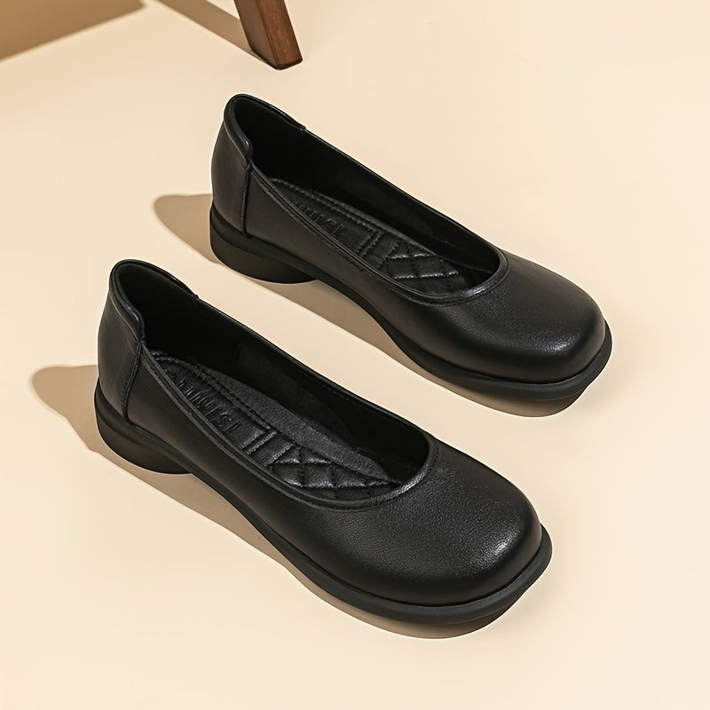 Women's black slip-on flats with an elegant design, comfortable round toe, soft and lightweight sole, and a microfiber cover. Perfect for professional attire with a sleek and cute look.