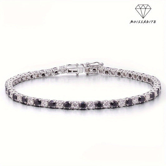 Tennis bracelet made of S925 sterling silver and plated with 18K gold, set with synthetic Moissanite stones in a 4mm two-tone black and white design. Featuring December birthstone, perfect for a sexy vacation style or music festival party. An ideal