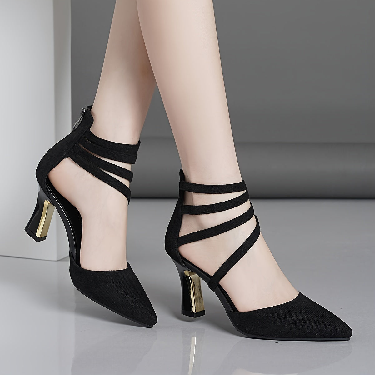 Women's sandals with pointed thin straps and thick heels.