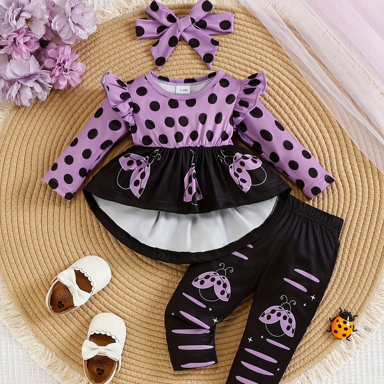 Ladybug print polyester toddler outfit with long sleeve crew neck pullover, matching pants, and headband. Made from slight stretch knit fabric for fall/winter. Regular fit raglan sleeve