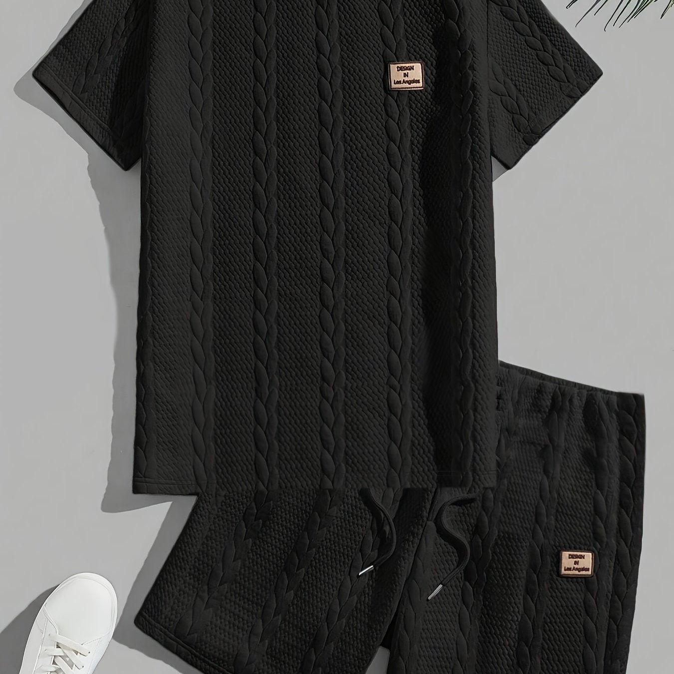 Men's black casual round neck short sleeve t-shirt and shorts set, made of soft, stretchy polyester with cable knit texture. Machine washable for all-season comfort.