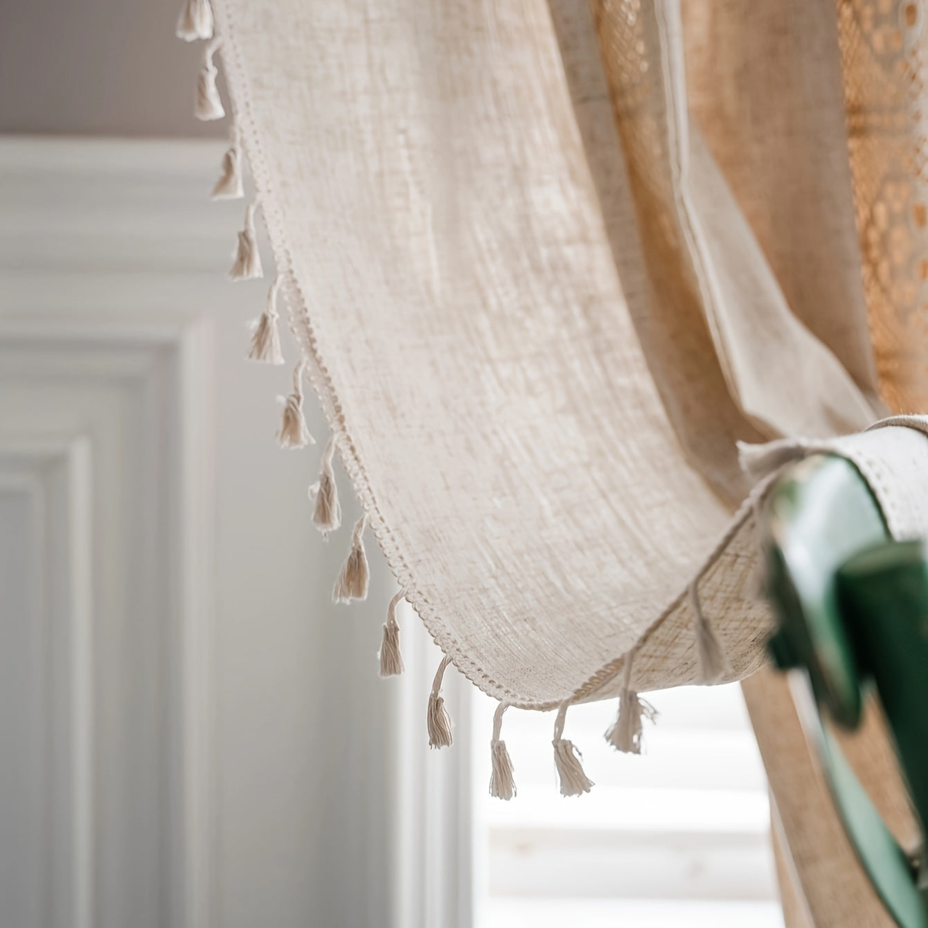 This American Farmhouse Style Curtain features a Boho Pure Linen design with decorative hollow patchwork and semi-blackout capabilities. Perfect for the living room, bedroom, bay window, dining room, kitchen, or bar, this curtain includes pocket square