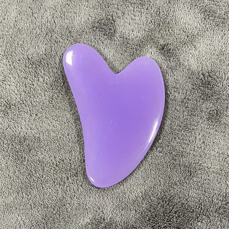 Heart-shaped resin Gua Sha tool for facial and full body hair removal, high-quality for beauty salon use.