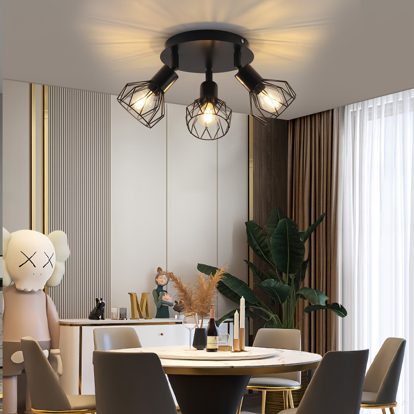 One black round LED ceiling spotlight with 3 bulbs that swivel 350°, suitable for living rooms, bedrooms, and hallways. Max. bulb capacity is 40W (bulb not included).