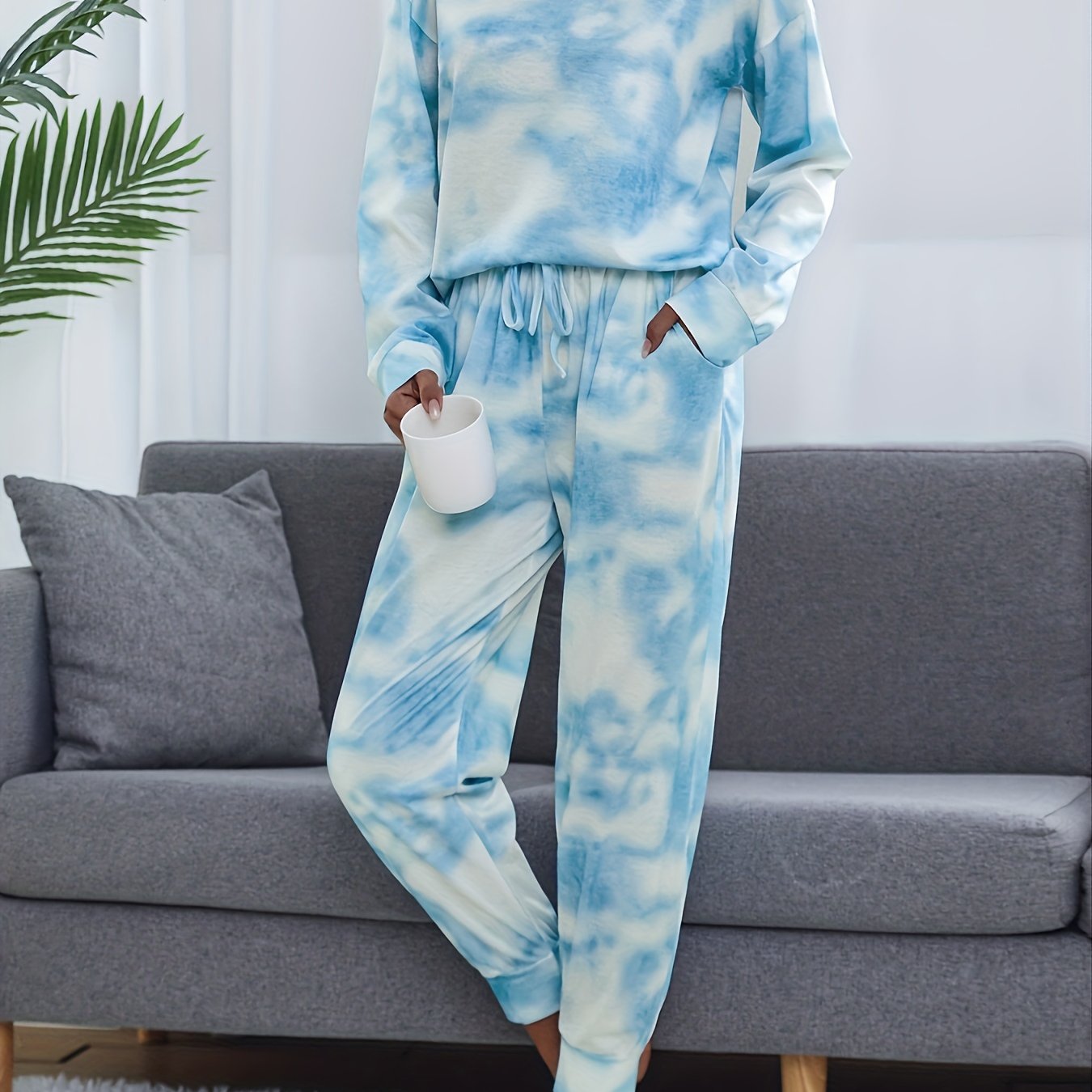 Tie dye lounge set for women, with long sleeve top and elastic waistband pants.